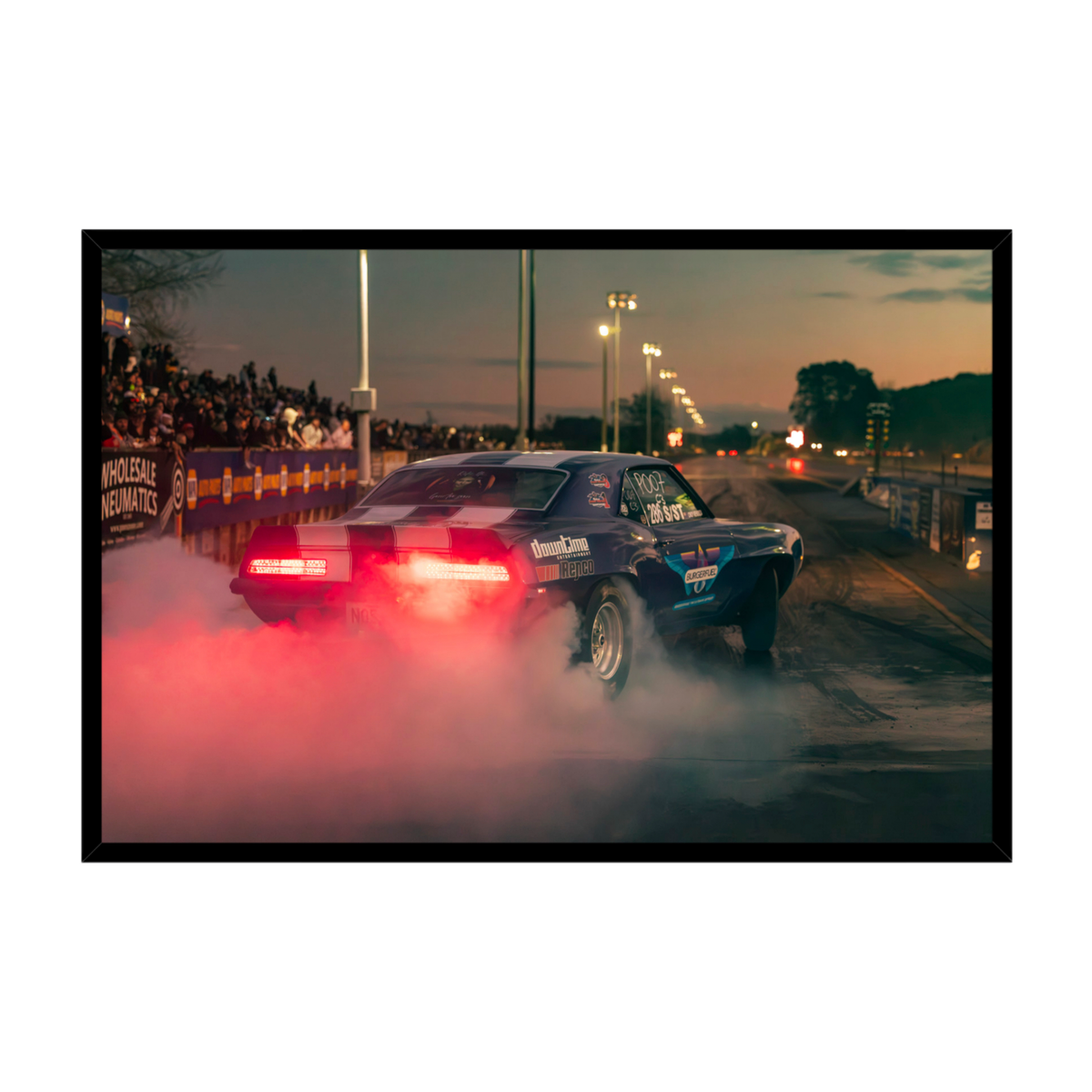 Mendoza Motorsport NZ Chevrolet Camaro drag racing with tyre smoke at dusk