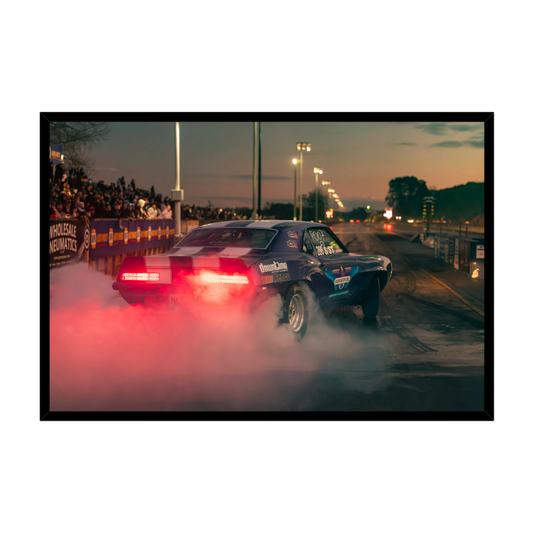 Mendoza Motorsport NZ Chevrolet Camaro drag racing with tyre smoke at dusk