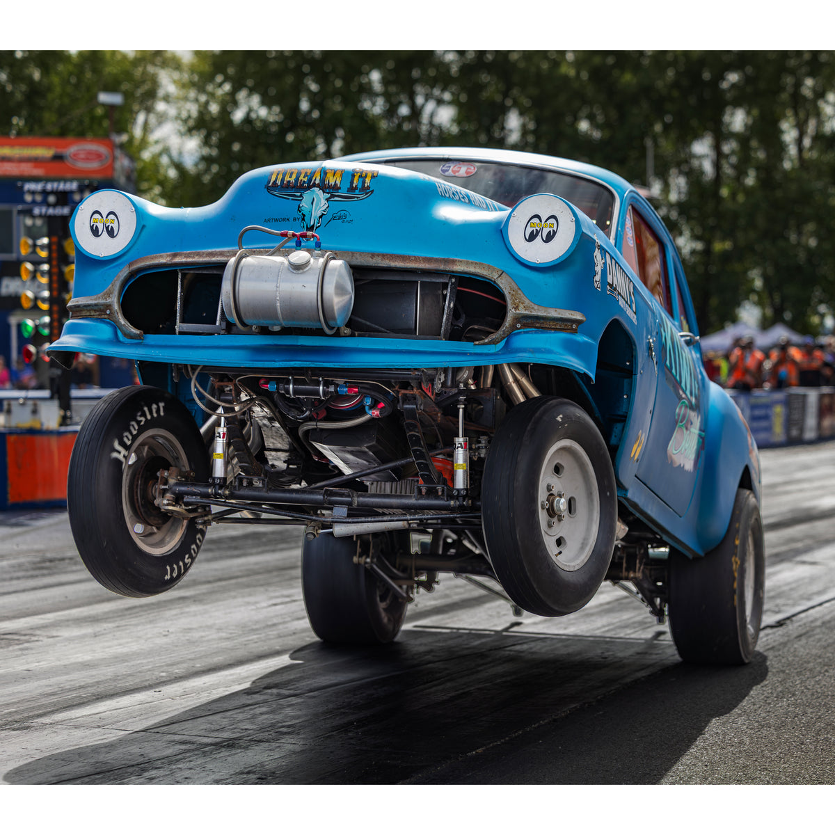 Blue race car competing on track at Bay Rodders Nostalgia Drags 2026 in New Zealand.